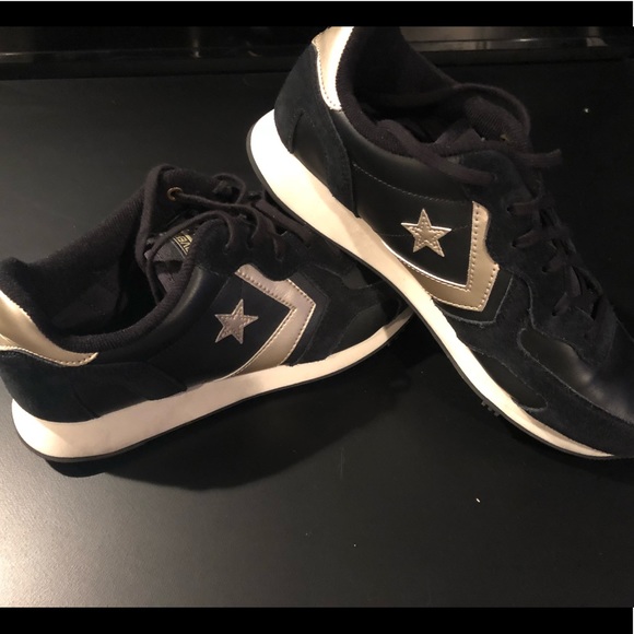 black and gold tennis shoes